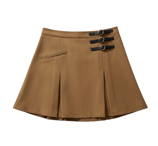 MAEHILL camel pleated mini skirt featuring three black faux-leather straps with gold-tone buckles and a side zip.