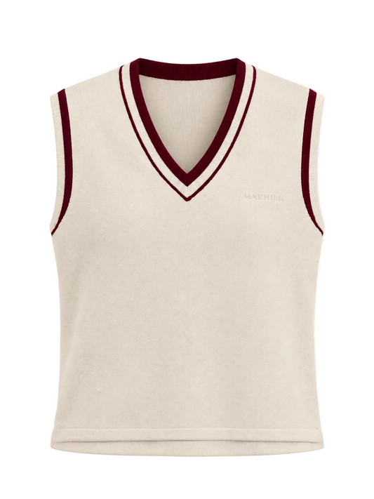 MAEHILL cream knit sweater vest with a V-neck, featuring burgundy and white striped trim and an embroidered logo.