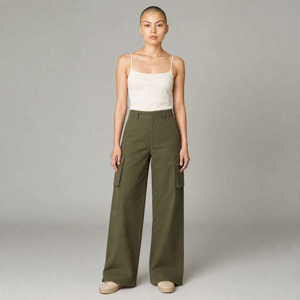 Model wearing MAEHILL olive green high-waisted wide-leg cotton twill cargo trousers with side pockets